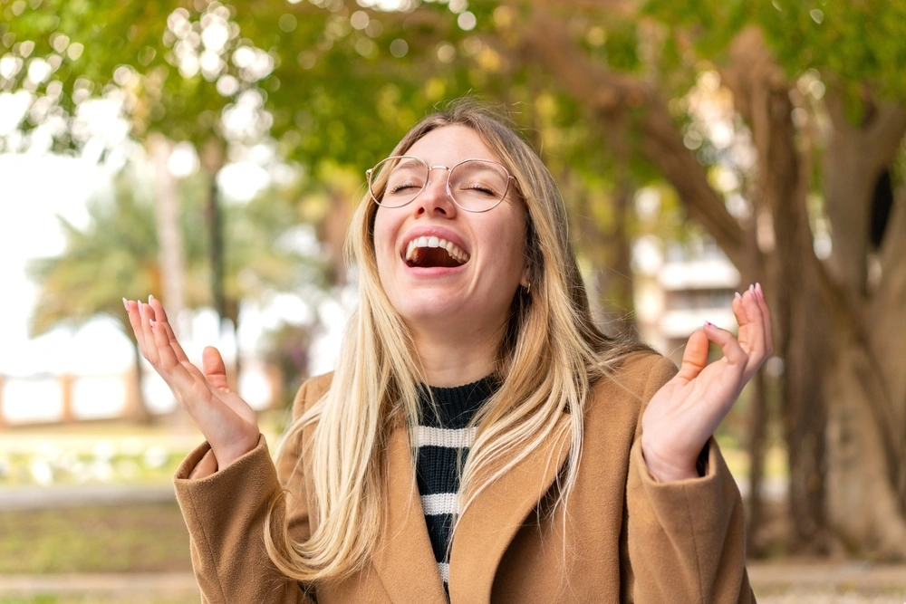 Happy Parkway Family Dental patient laughing outdoors